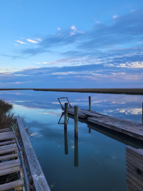 A dock extending across the calm water beside Beulah